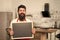 Man bearded hipster red apron stand in kitchen. Kitchen furniture store. Kitchen hacks concept. Clever ways to organize