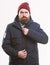 Man bearded hipster stand in warm black jacket parka isolated on white. Stylish and comfortable. Hipster modern fashion
