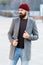 Man bearded hipster stylish fashionable coat and hat. Comfortable outfit. Achieve desired fit. Hipster outfit and hat