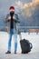 Man bearded hipster travel with big luggage bag wait for taxi bring him to hotel. Travel tips. Traveler with suitcase