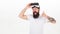 Man bearded hipster with virtual reality headset on white background isolated. What benefits of virtual reality headset