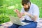 Man bearded with laptop sit meadow nature background. Writer looking for inspiration nature environment. Inspiration for