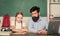 Man bearded pedagogue teaching informatics. Study online. Homeschooling with father. Find buddy to help you study