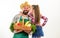 Man bearded rustic farmer with kid. Father farmer or gardener with daughter hold basket harvest vegetables. Farmers