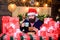 Man bearded santa claus hat reading letters. Generous new year. Lot of gifts. Happy winter holidays. Wrapped gifts with