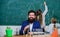 Man bearded teacher work with microscope and test tubes in biology classroom. Biology plays role in understanding of