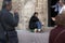 man begging on a church door in Mallorca