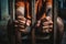 Man behind prison bars. Men\\\'s hands rest on the bars of a prison or prison cell. Conclusion concept. Crime and Punishment.