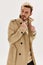man in beige coat fashion hairstyle modern style autumn cropped view