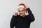 Man being excited about christmas or new year celebration. Happy crazy facial expression  on gray background. Boy in a