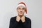 Man being excited about christmas or new year celebration. Happy crazy facial expression  on gray background. Boy in a