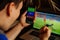 Man being happy winning a bet in online sport gambling application on his mobile phone