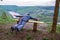 A man on a bench on a cliff.