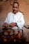 A man berber while working pottery with a lathe in a village in Morocco