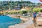 Man on bicycle at Ascona luxury tourist resort promenade