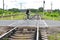 Man on bicycle crosses a railway crossing, bicycle pedal on rails.