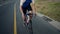 Man, bicycle and cycling on mountain road for workout. exercise or outdoor training on asphalt. Active male person