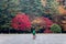 Man on bicycle standing in autumn park