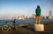 Man with bicycle watching sunset over lake Ontario Waterfront and Toronto downtown panorama