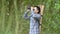 Man with binoculars telescope in forest looking destination as lost people or foreseeable future. People lifestyles and leisure