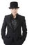 Man in black austere suit and hat