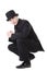 Man in black austere suit and hat