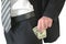 Man in black business suit, holding cash in hands