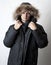 Man in black fur hood winter jacket