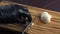 Man in black gloves cutting champignons with kitchen knife on wooden cutting board. Cooking mushroom