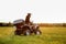 A man in a black helmet rides an ATV