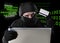 Man in black holding credit card using computer laptop for criminal activity hacking password and private information