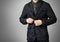 A man in a black jacket. Buttons of the hand button. Isolated on