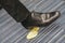 Man with black leather shoes slips by banana peel