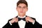 Man in a black suit adjusts his bow tie close-up