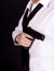 Man in black suit holding gun in hand. Secret agent, mafia, bodyguard concept