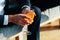 Man in black suit sitting on chair and drinking coctail