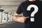 Man in black t-shirt with question mark