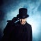 Man in a black top hat and cloak. Demonic image. Magician illusionist