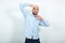 Man with blond hair, black beard over isolated white background shows emotions