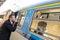 Man blowing kiss to woman on train