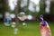 A man blows soap bubbles. Close up