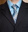 Man in blue business suit detail.