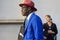 Man with blue jacket and red Borsalino hat before Tods fashion show, Milan Fashion Week street