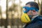 A man in blue safety glasses and a homemade pomelo mask. The concept of protection against coronavirus infections covid-19