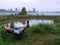 Man in blue shirt looking at beautiful nature at dusk laying down on a armchair. Private high value property with lake. Relaxing