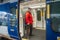 Man boarding train at Oxenholme Lake District railway station