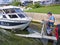 Man at Boat Launch Loading a Fishing Boat on Trailer