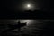 Man in boat swimming in sea during full moon illustration