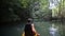 man boating in kayak along lagoon