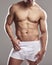 Man body, sexy underwear model and stomach with strong chest, abs and wellness in studio. Bodybuilder, exercise and